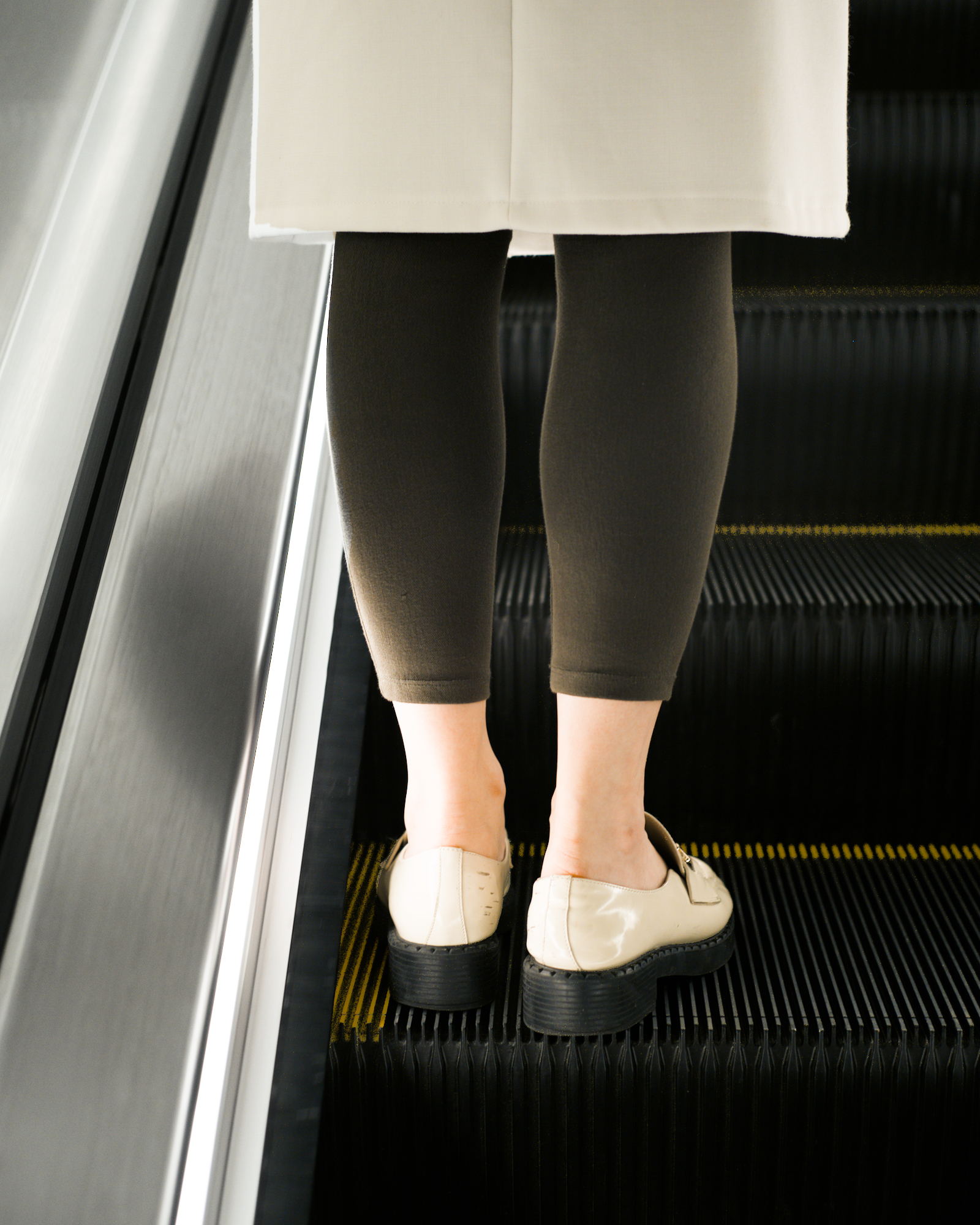 No Turning, 4 - Martin Place: Ankles ascend escalator from underground metro station.